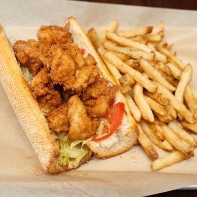 Fried shrimp Po' Boy, with fries.