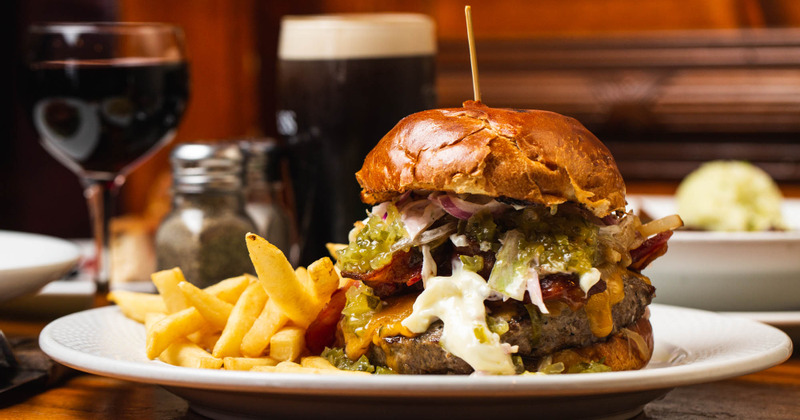 Sandwich with veggies, avocado, pickles and potatoes