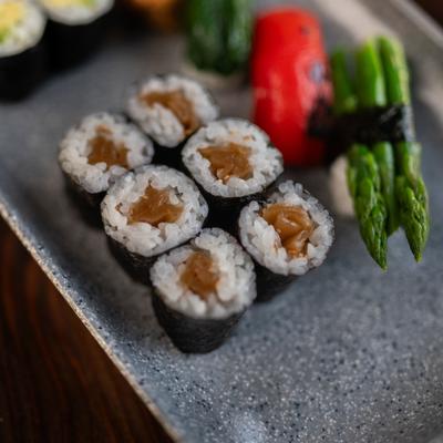 Sushi rolls and veggies.