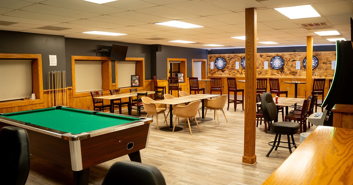 Game room, seating area, pool table, dartboards