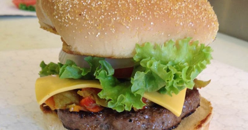 A close up of a cheeseburger