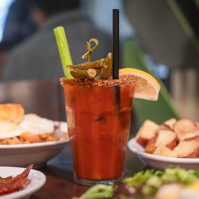 Bloody Mary, surrounded by breakfast dishes.