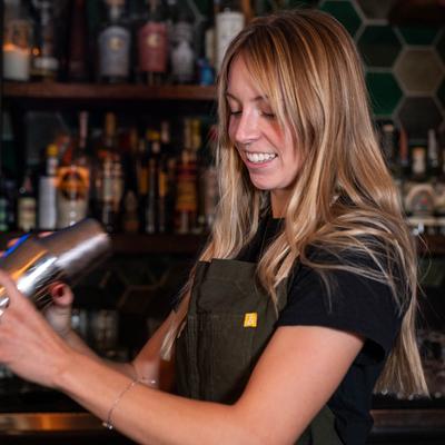 Bartender mixing a cocktail.