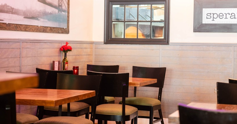 Interior, dining tables and seats waiting to receive guests
