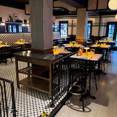 Interior with tiled floors and set tables.