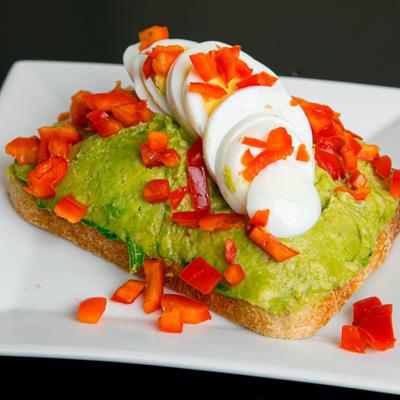 Avocado toast, with red bell peppers and boiled egg.