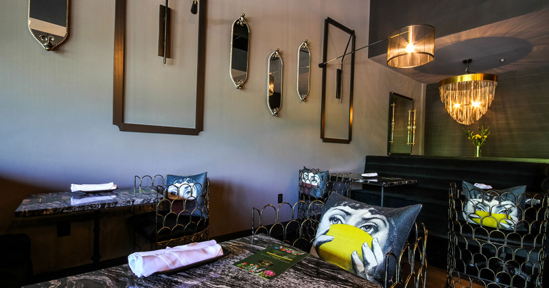 Interior, table ready for guests and decorations on the wall