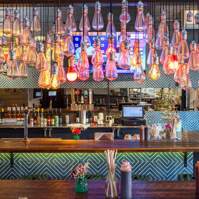 Interior with a large collection of Edison bulbs hanging from the ceiling.
