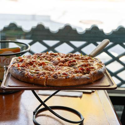 Pizza on a wooden board.