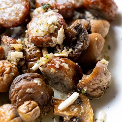Italian sausage and mushrooms, with olive oil, garlic sauce, and sliced almonds.