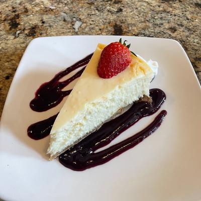 Vanilla Bean Cheesecake, with strawberry and chocolate drizzle
