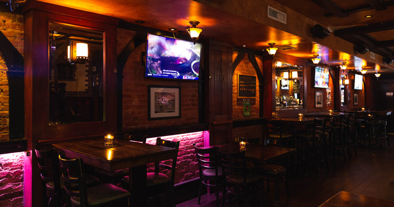 Interior, tall tables by the brick wall