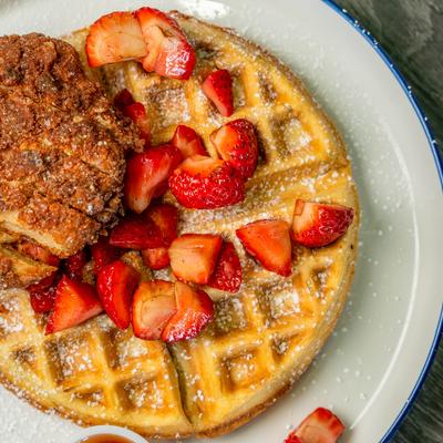 Chicken and waffles with strawberries