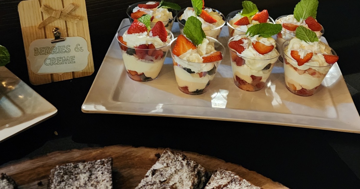 Berries and cream desserts in clear cups
