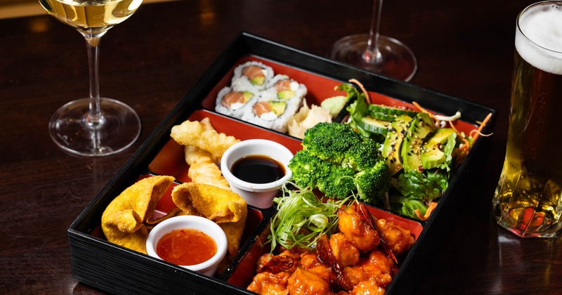 Bento box, served on the table with white wine