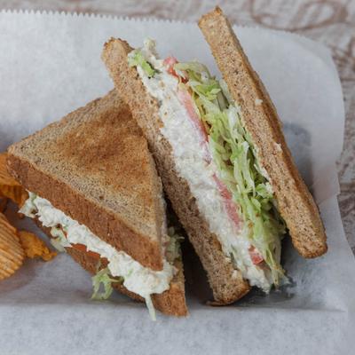 Chicken salad sandwich, with lettuce and tomato.