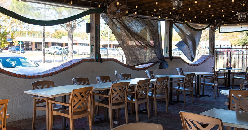 Covered patio with tables and chairs