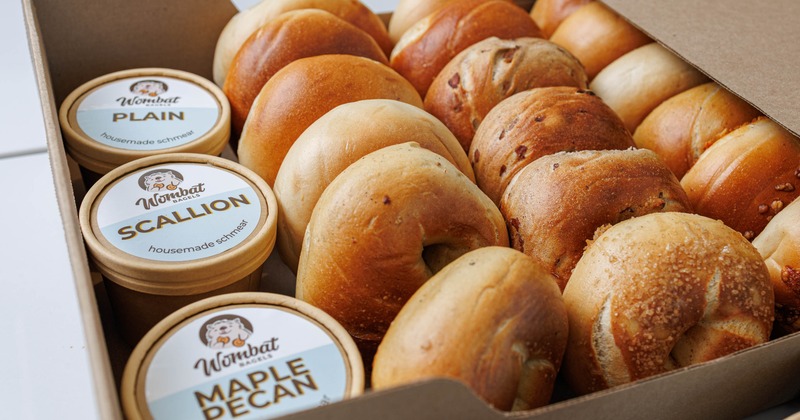 Catering box with bagels and different cream cheese spreads