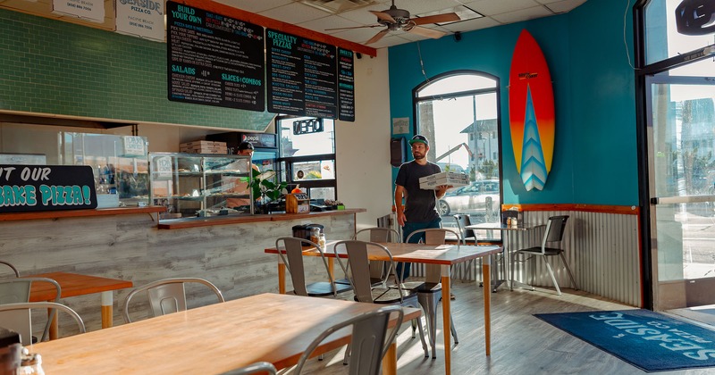 Order counter and seating area, surfboard on a wall