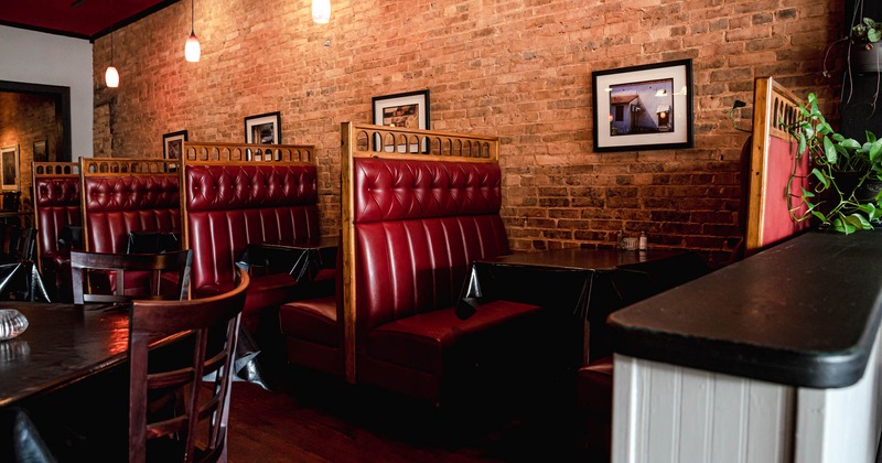 Interior, upholstered button tufted leather booths