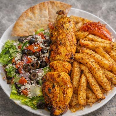 Chicken Kabob plate with fries and side salad.