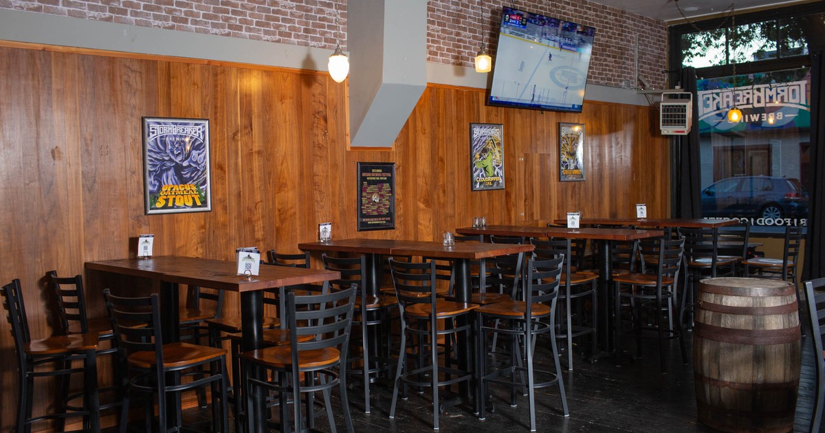Interior, high seating area, high tables with stools, ready for guests, shop window