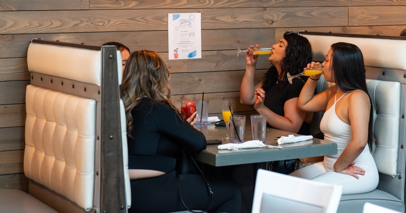 Booths, people drinking