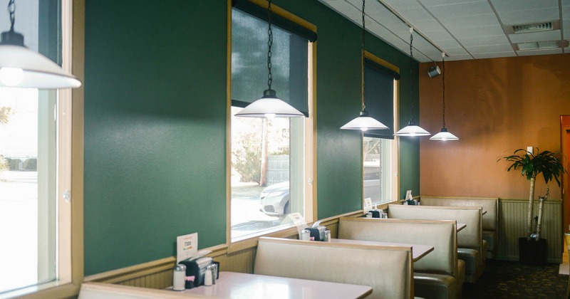 Interior, dining area, booth seating area by the windows