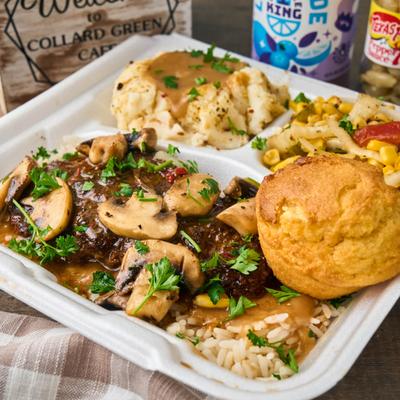 Steak with mushrooms and mashed potatoes.