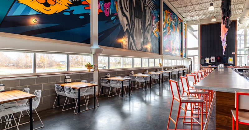 Interior, bar area, tables and seats, mural art