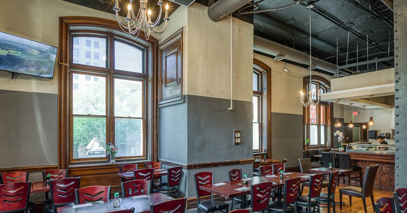 Interior, dining area with chairs and tables with windows behind