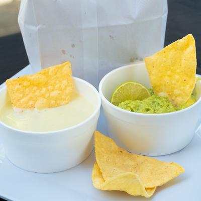 Guacamole and cheese dipping sauces.