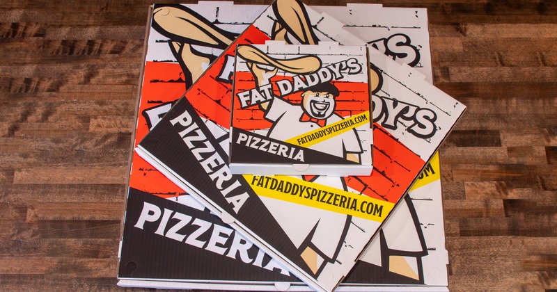Stack of Fat Daddy's pizza boxes