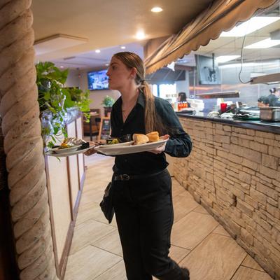 Employee carrying food.