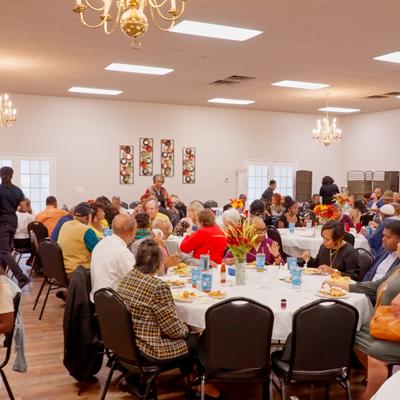 Groups of people seating in the dining area.