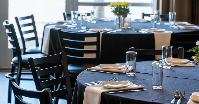 Interior, table set for guests in dining area