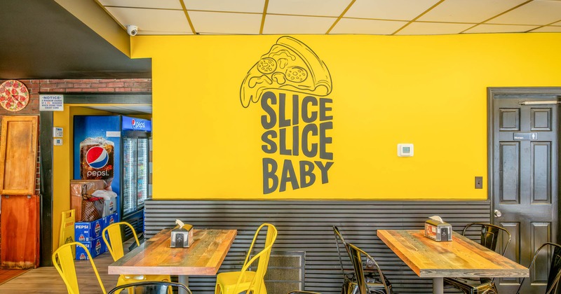 Interior, wooden tables, and metal chairs in a casual dining setting.