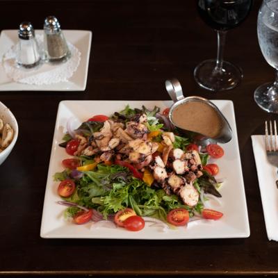 Mixed salad, served  with dressing.