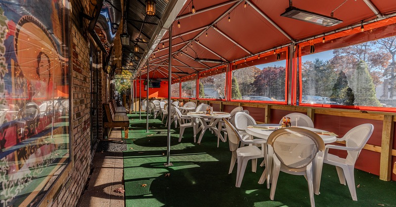 Covered patio with dining tables