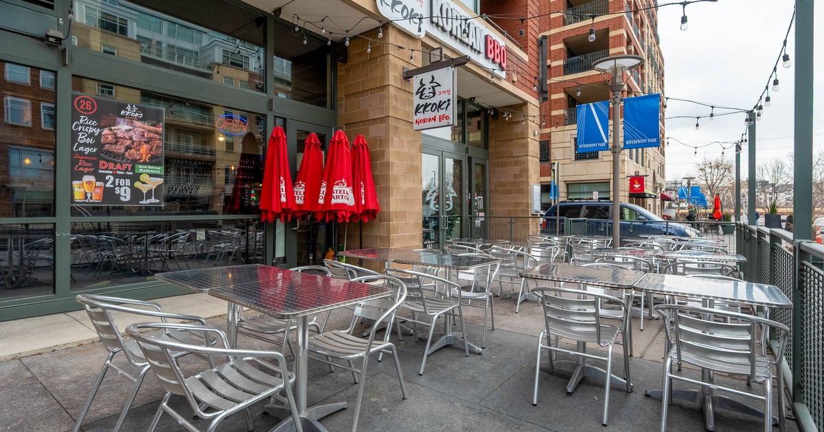 Exterior, patio, outdoor seating area, aluminum tables and chairs, lanterns as a decoration