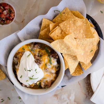 Tamale bowl served with tortilla chips.