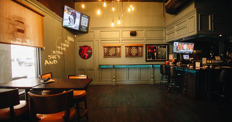 Interior, seating area with dartboards on the wall