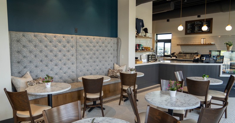 Interior, tables and chairs in seating area