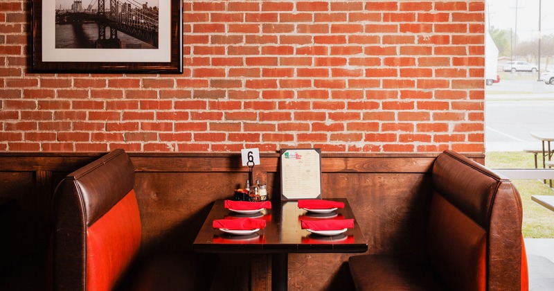 Restaurant booth, tables set with tableware