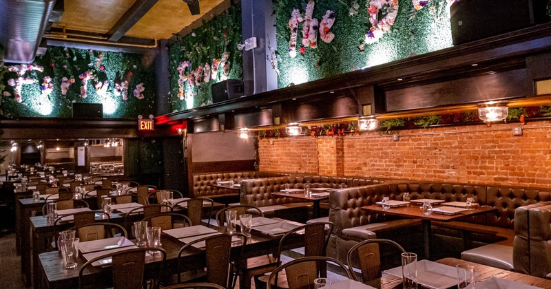 Interior, seating area, U shaped brown leather seating booths with tables
