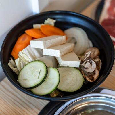 Bowl of various veggies and tofu.