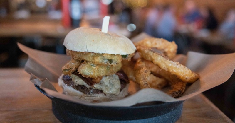 Cheeseburger, with fried pickles, bacon and onion rings