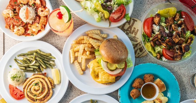 Overhead view of the assorted dishes on the table with drinks