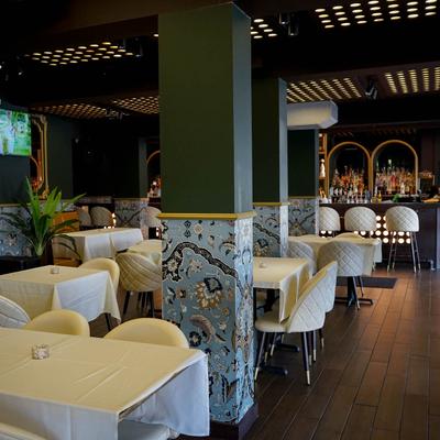 Dining area with big TV on the wall
