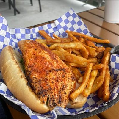 Grilled fish sandwich, with fries.